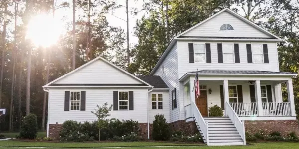 White house with a beautiful yard